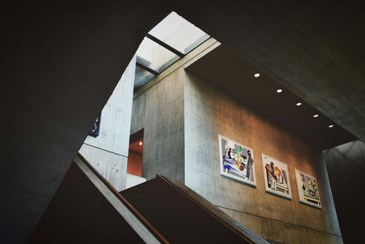 Interior of a modern Berlin art gallery with artists and visitors engaging