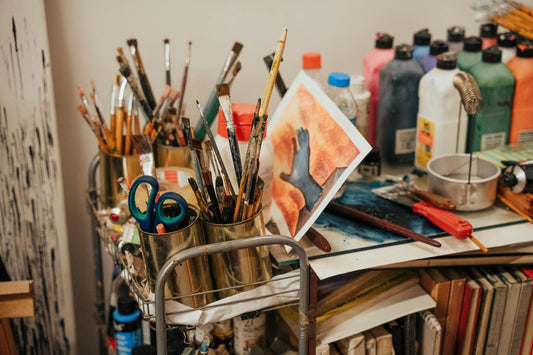 A close-up of high-quality art supplies arranged neatly in an artist’s Berlin studio