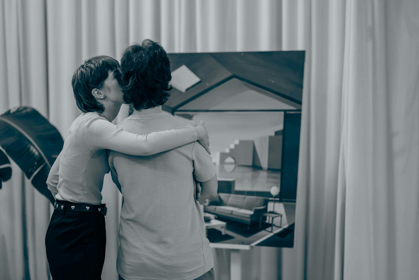 Contemporary art exhibition with immersive installation and visitors engaging
