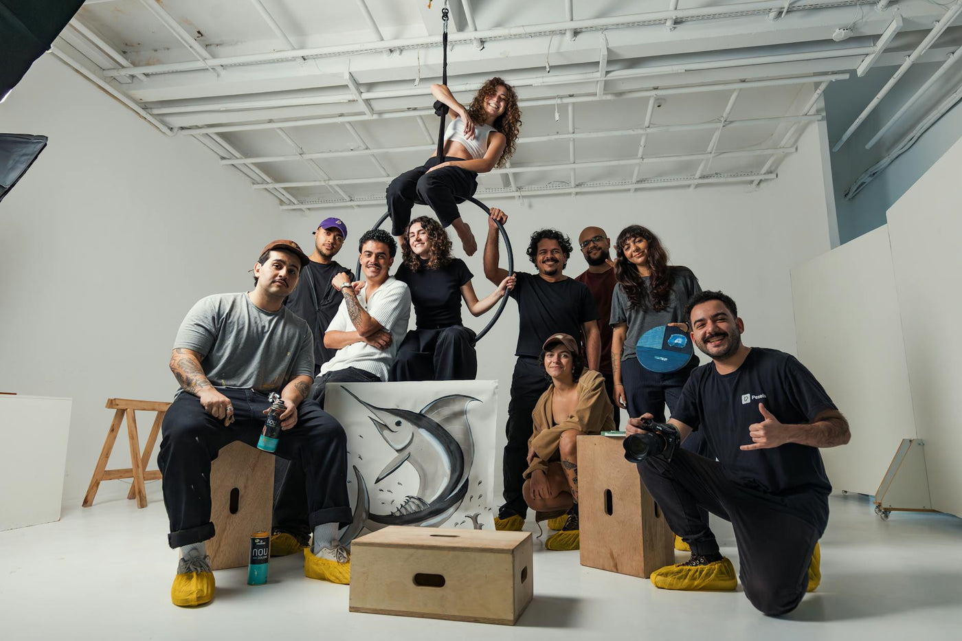 A group of diverse artists collaborating in a modern Berlin studio space