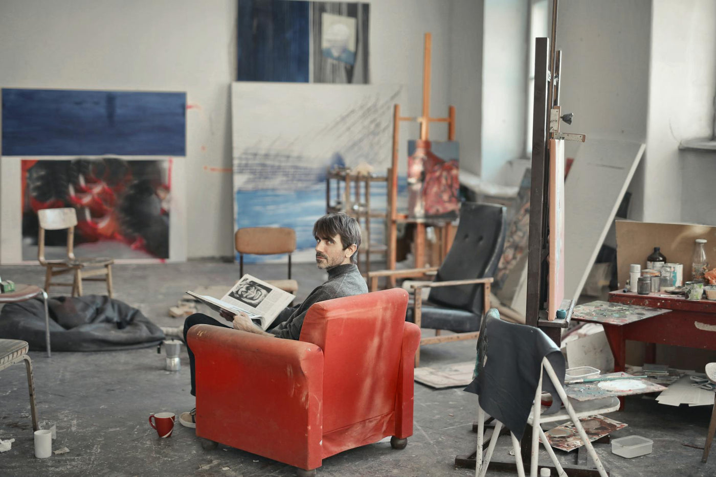 Artists working collaboratively in a spacious Berlin studio