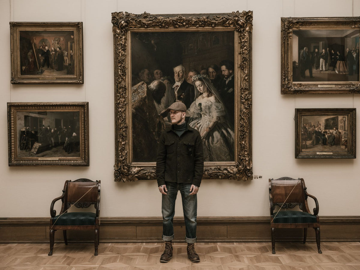 Art collectors examining a genuine artwork in a modern gallery