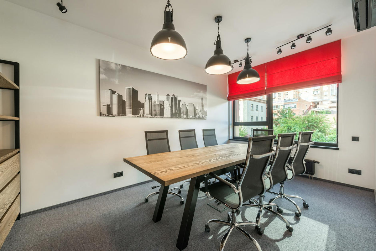 Minimalist modern office space with contemporary art on the walls