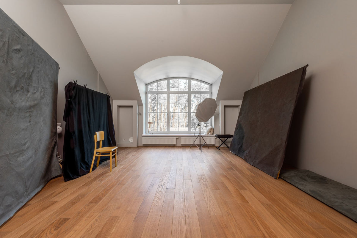 Artist working in a minimalist Berlin studio surrounded by artworks