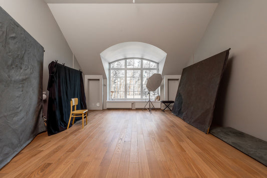 Artist working in a minimalist Berlin studio surrounded by artworks