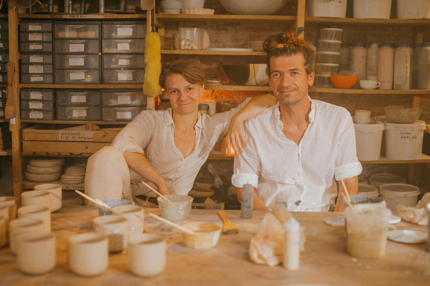 Artists collaborating in a bright Berlin studio space